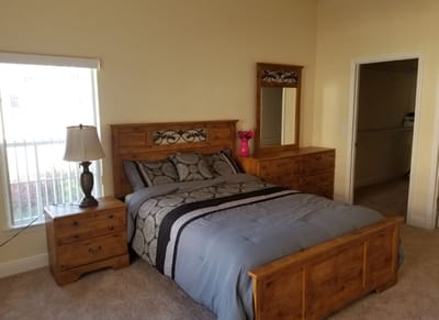 A private resident room with a bed and furniture