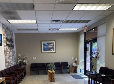 Interior waiting area with seating and artwork
