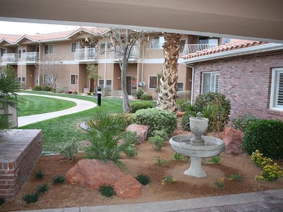 Outdoor area with landscaped garden and fountain
