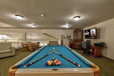Pool table in a common area with seating