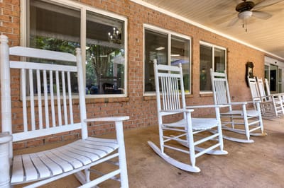 Row of rocking chairs on a porch