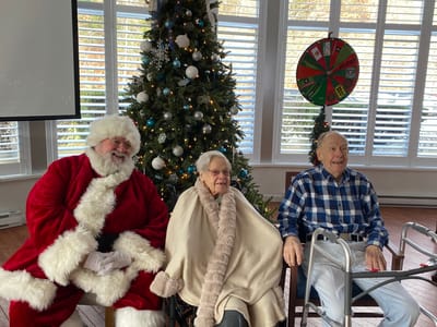 Residents enjoying a holiday celebration with Santa