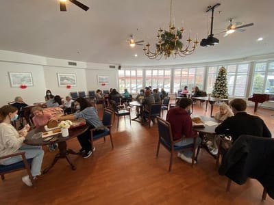 Residents enjoying a meal and socializing in a dining area