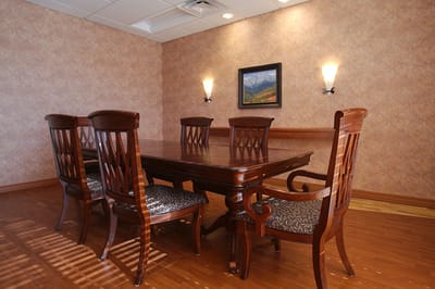A well-furnished dining area with wooden furniture