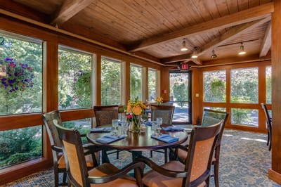Bright dining area with floral centerpieces