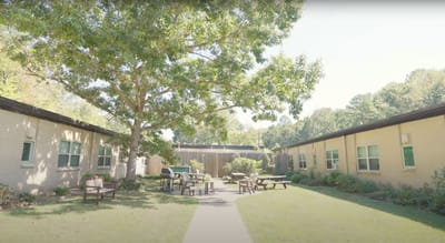 Outdoor courtyard with seating areas and trees