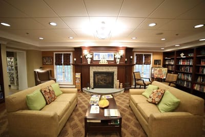 Cozy common area with comfortable seating and bookshelves