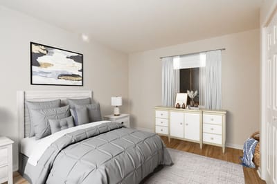 Cozy, well-decorated bedroom in assisted living unit