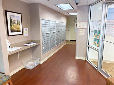 Interior corridor with mailboxes and artwork