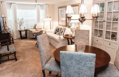 Bright and inviting interior space with dining area and seating