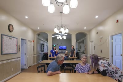Residents and staff interacting in a common area