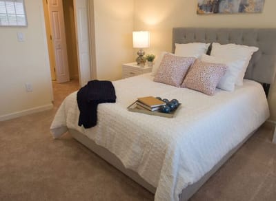 Cozy bedroom with a neatly made bed and decor