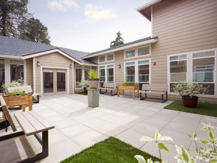 Outdoor courtyard with seating and landscaping