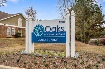 Exterior sign for Oaks at Cedar Shoals facility