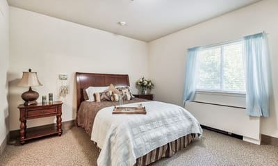 A furnished private bedroom in the facility