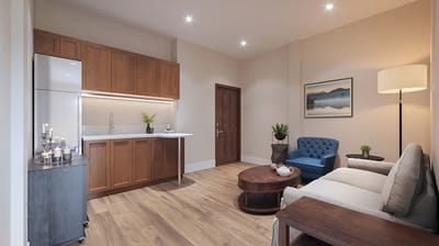 A modern living room setting with a kitchen area