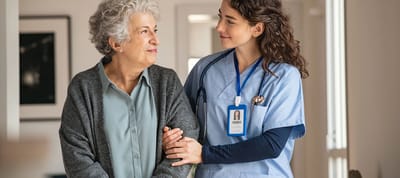 Healthcare worker assisting an elderly resident