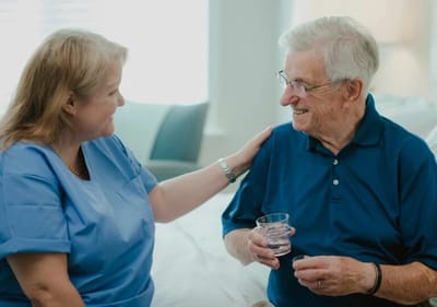 Caregiver interacting with an elderly resident.