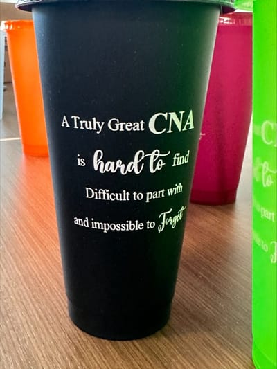 Colorful cups with motivational text
