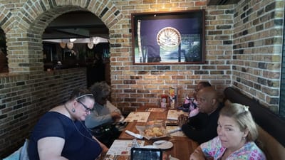 Residents enjoying a meal together in a dining setting