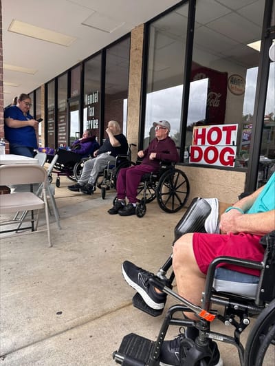 Residents sitting outside in wheelchairs