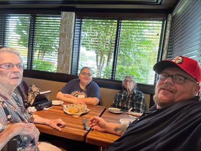 Residents enjoying a meal in the dining area.