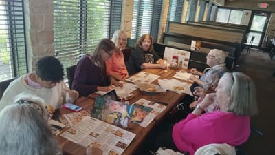 Residents enjoying a meal together at a dining area.