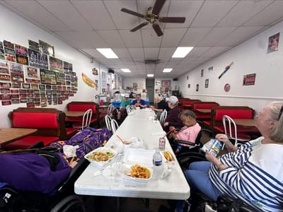 Residents enjoying a meal in the dining area.