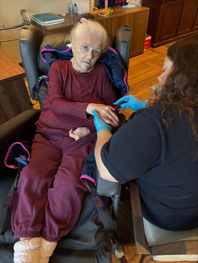 Caregiver assisting a resident with personal care