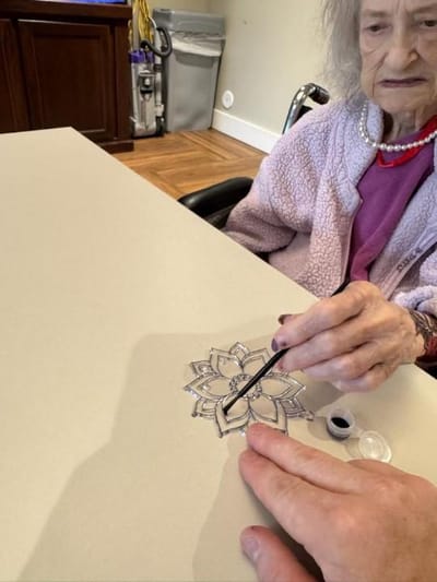 Resident engaging in a creative activity.