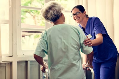 Staff assisting a resident indoors