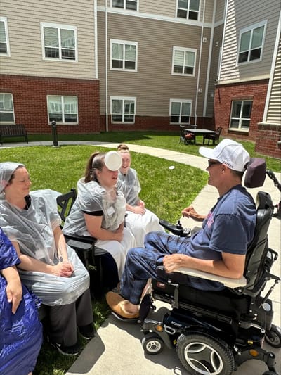 Residents enjoying an outdoor activity.