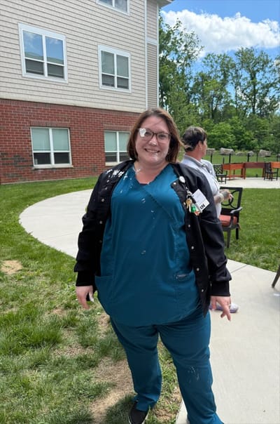Staff member outside at the facility
