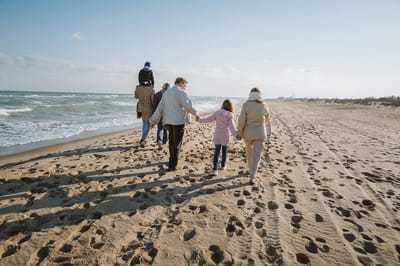 Group walking along the beach together