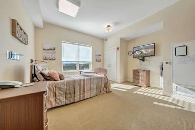Cozy resident room with natural light.