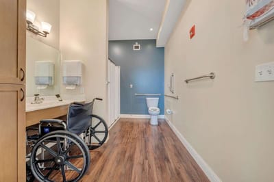 Accessible restroom with a wheelchair.