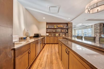 Modern common area with wooden cabinetry and decor