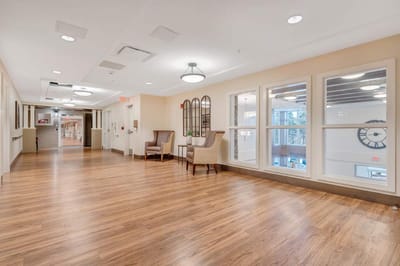 Bright hallway with seating and large windows