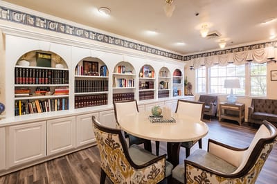 Common area with bookshelves and seating