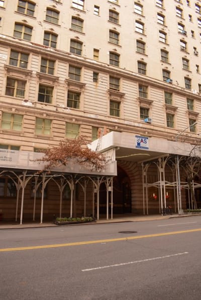 Facade of The Belnord with awning and signage