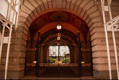 Exterior view of a building entrance with gates