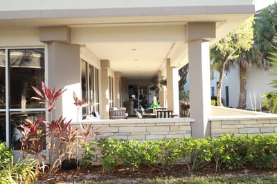 Outdoor patio area with seating and plants