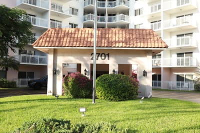 Exterior view of the facility entrance with landscaping