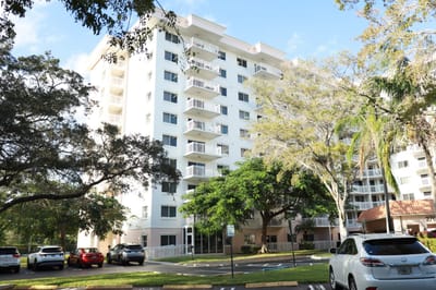 Exterior view of The Court at Palm Aire building
