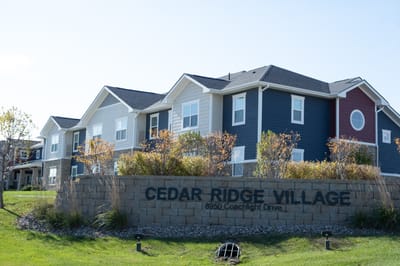 Exterior view of Cedar Ridge Village with landscaping