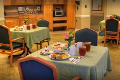 Dining area set up for a meal with food and drinks