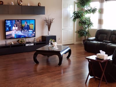 Bright common area with a television and seating