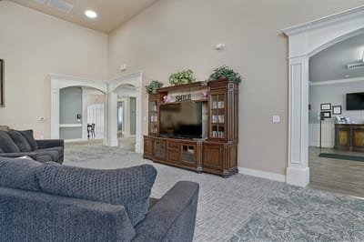 Interior lounge area with seating and TV