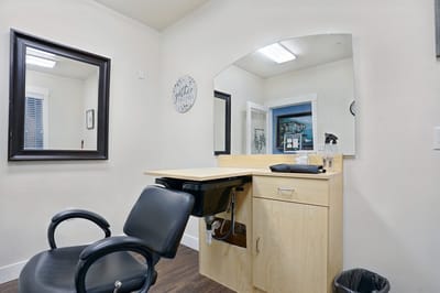 Interior beauty salon with a styling chair and mirror