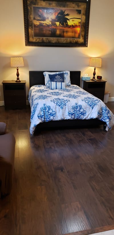 Cozy resident room with bed and lamps